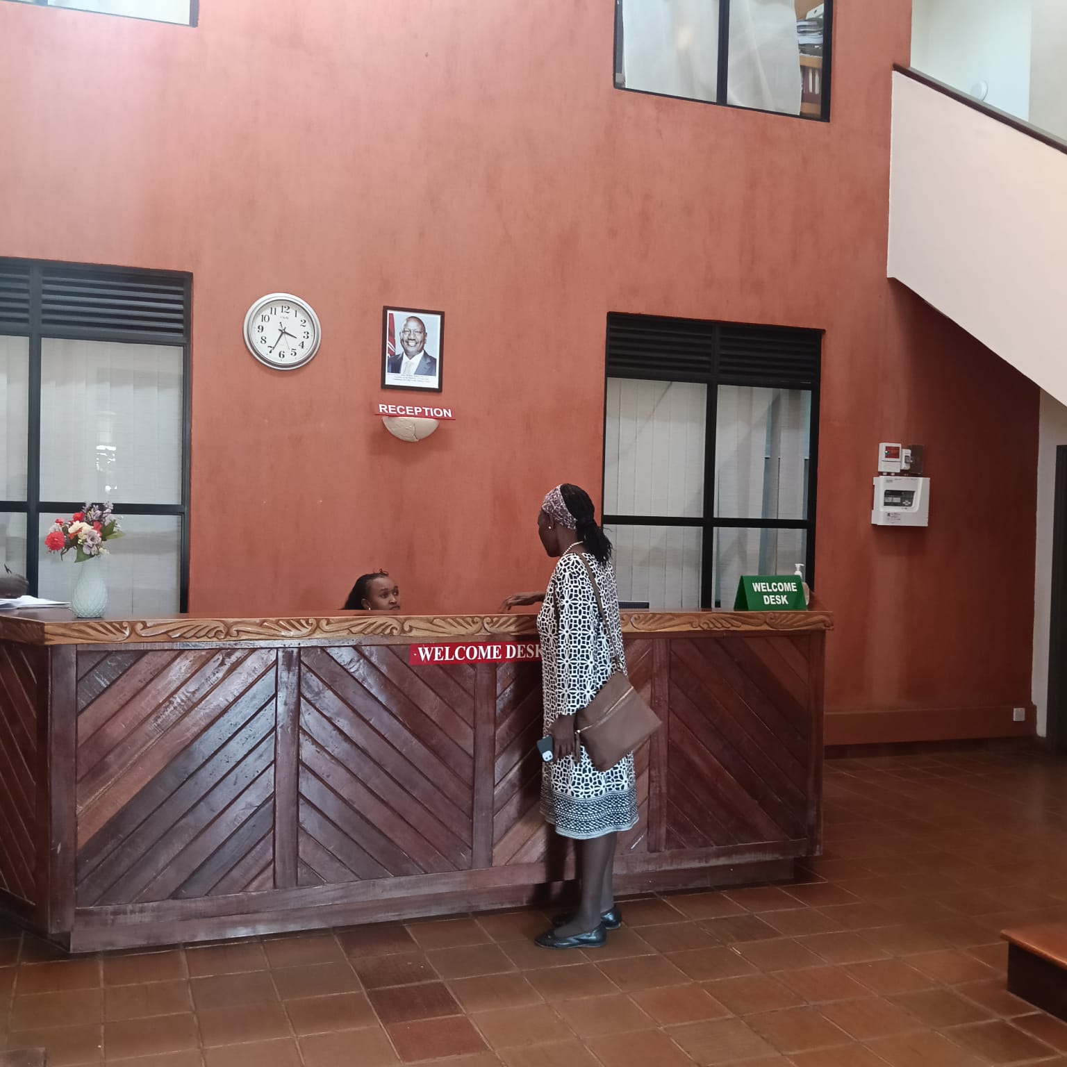 AYHEM representative at the welcome desk of Africa International University